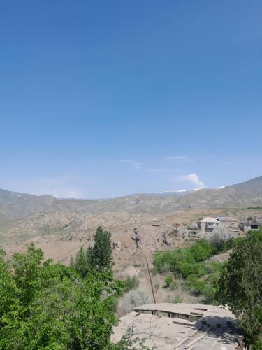 a view of a desert with mountains in the background at Mark in Yeghegnadzor