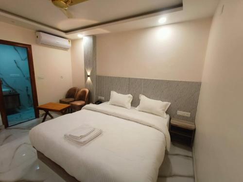 Кровать или кровати в номере Hotel GD Grand Inn