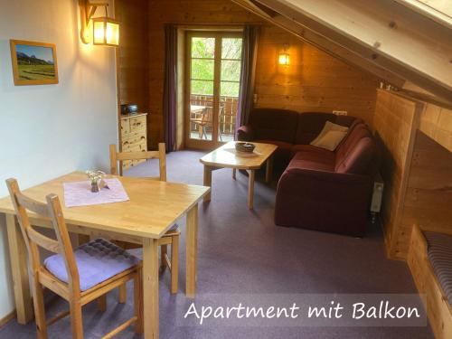 a living room with a couch and a table at Ferienwohnungen Bernie Schmid in Sonthofen