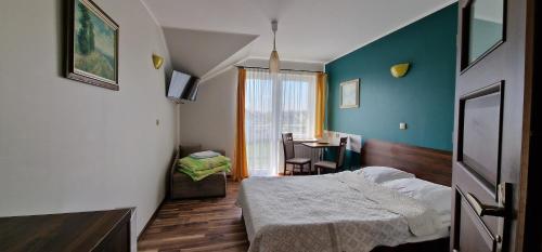 Postel nebo postele na pokoji v ubytování Róża Wiatrów Władysławowo