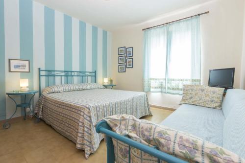 En eller flere senger på et rom på Villa Monserrato - Goelba