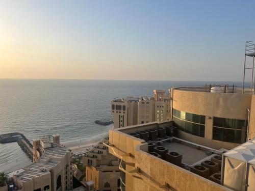a view of the ocean from the top of a building at fantastic city & Seaview Master bedroom in 3bedroom apartment in Ajman 