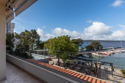 a balcony with a view of a marina at Apartments Sax in Crikvenica