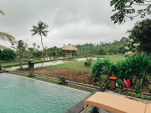 a view of a resort with a swimming pool at Pondok Apsari 2 in Singaraja