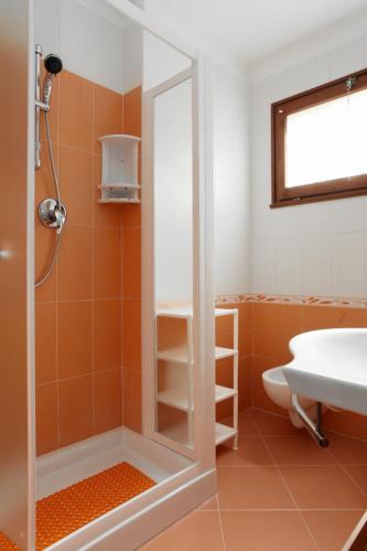 a bathroom with a shower and a sink at Villa Chiara in Rosolina Mare