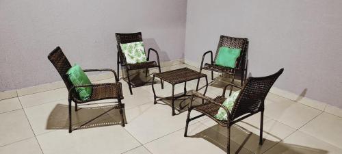 a group of chairs and tables in a room at Puro Encanto Refúgio - Agrishow in Ribeirão Preto