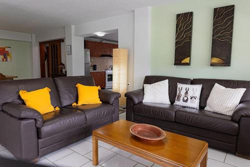 a living room with two couches and a coffee table at Arches in Agria