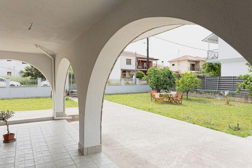 an arched patio with a park in the background at Arches in Agria