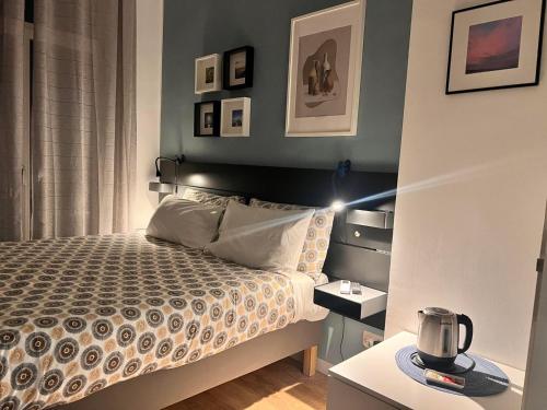 a bedroom with a bed with a light on it at Garibaldi R&B in Messina
