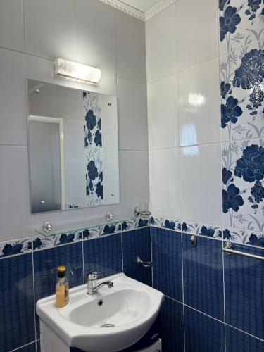 a bathroom with a sink and a mirror at Casa Otilia in Chişcău