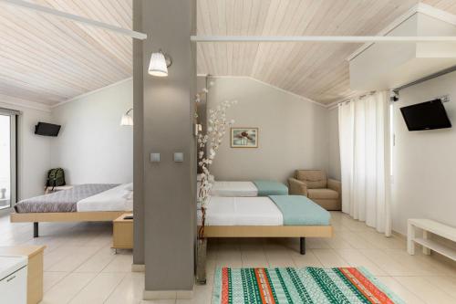 Postel nebo postele na pokoji v ubytování Zefyros Sea View Hotel