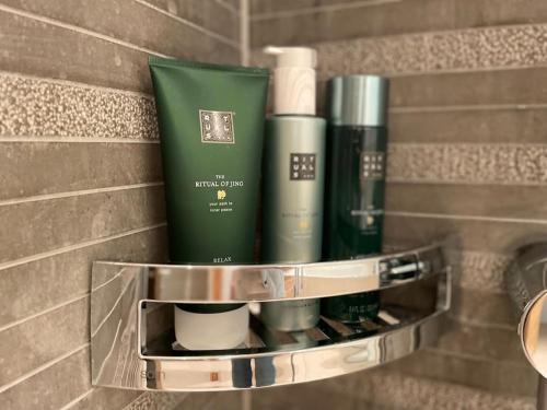 a shelf in a bathroom with some products on it at Spacious Family Apt Flims close to Lake Cauma in Flims