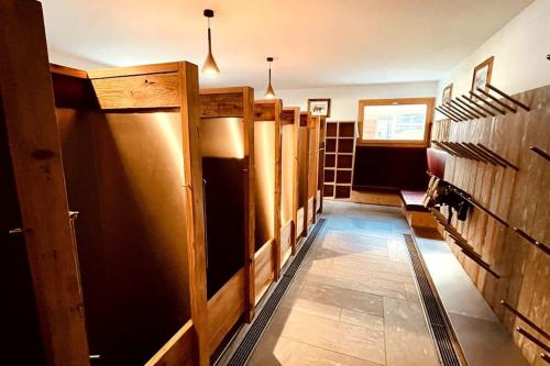 a hallway with wooden stalls in a room at Spacious Family Apt Flims close to Lake Cauma in Flims