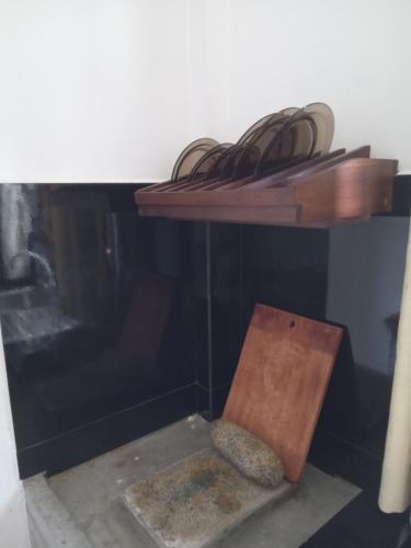 a shelf with wires on top of a fireplace at Metro Stay in Kurunegala