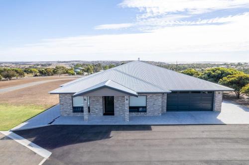 a rendering of a house with a garage at The Lux Country Retreat - large swimming pool - immaculate views and stylish comfort! in Port Lincoln