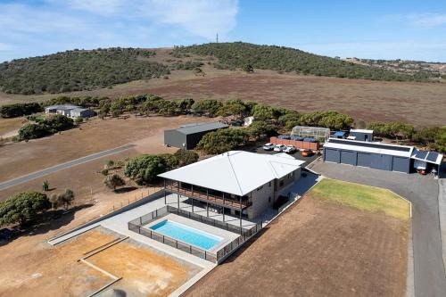 an aerial view of a house with a swimming pool at The Lux Country Retreat - heated swimming pool - immaculate views and stylish comfort! in Port Lincoln