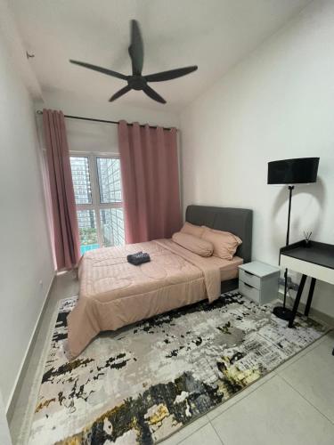 a bedroom with a bed and a ceiling fan at Canopy Hill by Azli in Kajang