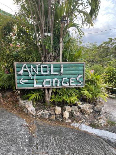 a sign on the side of the road at TIANOLI lodge grand confort avec vue magnifique in Sainte-Anne