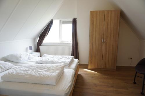 Postel nebo postele na pokoji v ubytování Kustverhuur, Park Schoneveld, Stern 240