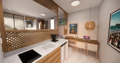 a kitchen with a sink and a counter at Matzi Hotel Apartments in Gerani Chanion