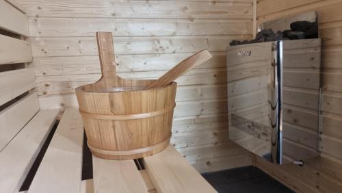 a wooden chair in the corner of a sauna at TOBO house along the river Danube in Radvaň nad Dunajom