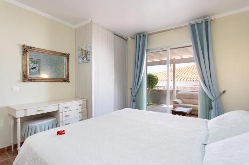 Giường trong phòng chung tại Villa Gaia