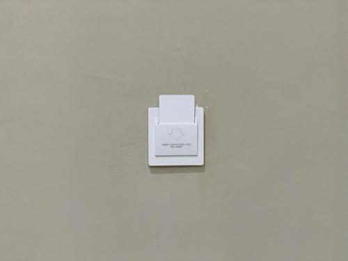 a white box sitting on a white wall at Aislah Edotel Lombok in Sakra