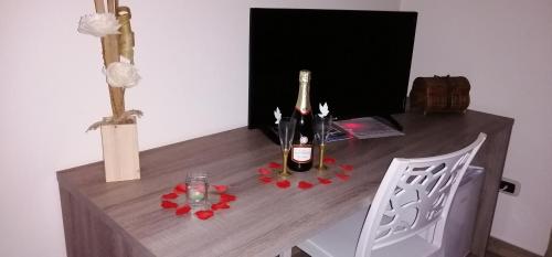 a table with two bottles of champagne on it at Alba Ionica Taranto in Taranto