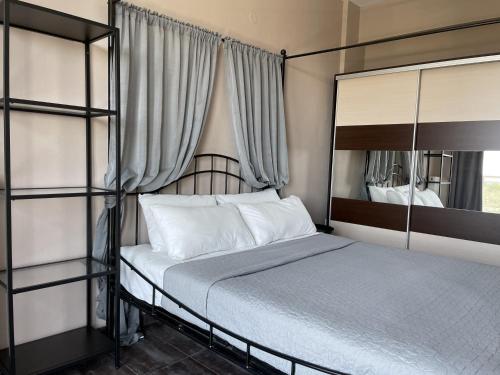 a bedroom with two bunk beds and a mirror at Discovery Villas in Limenaria