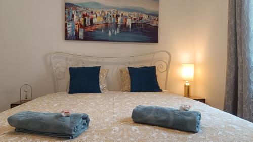 a bedroom with a bed with two pillows on it at Apartment Marlena in Mokošica