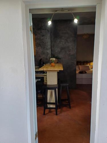 a kitchen with a table and chairs in a room at Travelers Nest in St Lucia