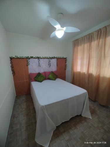 Ένα ή περισσότερα κρεβάτια σε δωμάτιο στο Aconchego famíliar