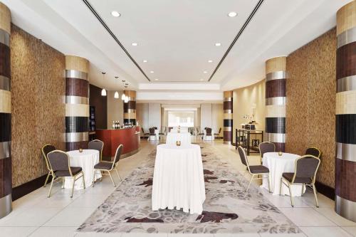 a banquet hall with tables and chairs in a room at Embassy Suites by Hilton Alexandria Old Town in Alexandria