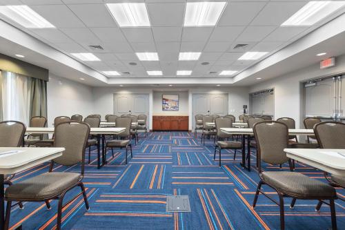 an empty classroom with tables and chairs in a room at Hampton Inn Cape Girardeau I-55 East, MO in Cape Girardeau