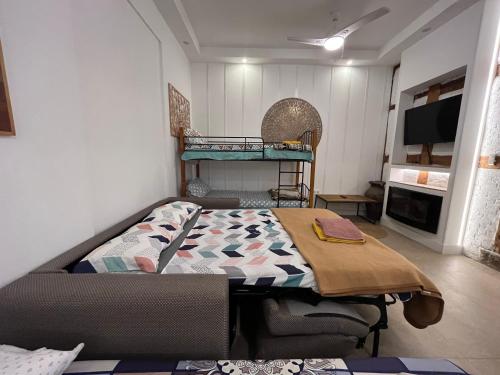a room with a bed and a table in it at Best loft luxury in Madrid center 12 in Madrid