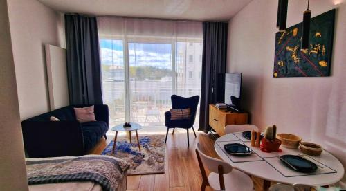 Et opholdsområde på Darłowo Premium Holiday Sunset Blvd Apartment for Two by Marina Royale