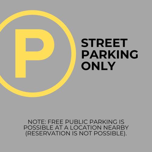 a sign that reads street parking onlynotice free public parking is possible at a location at The Old White Hart Brewery Guesthouse in Bath