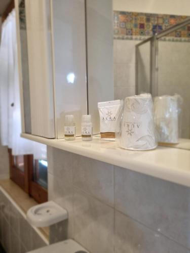 a bathroom with a sink and towels on a counter at MARY FAMILY HOME in Polverigi