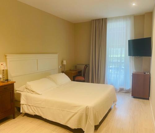 Postel nebo postele na pokoji v ubytování Hotel Mon Repos