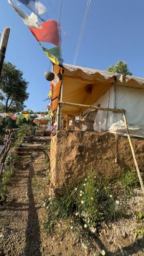 a building with a tent in the ground at Ananta Prana in Mussoorie