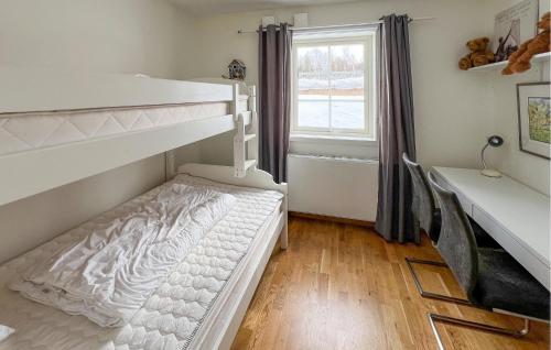 a bedroom with two bunk beds and a window at Awesome Apartment In Gl With Wifi in Frya