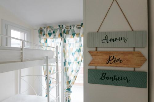 a bedroom with a bunk bed and a sign that reads uneasy new bedroom at Mylarakia in Chios