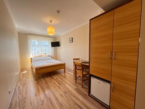 Ένα ή περισσότερα κρεβάτια σε δωμάτιο στο Willa Zieloneczka