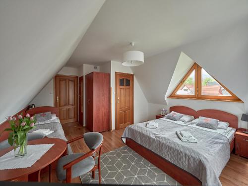 Postel nebo postele na pokoji v ubytování Willa Za Cieszynianką