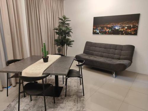 a living room with a couch and a table at Eagle Nest 1-BR in Ashrafieh in Beirut