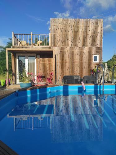 a swimming pool in front of a house at Ardkub in Montréal
