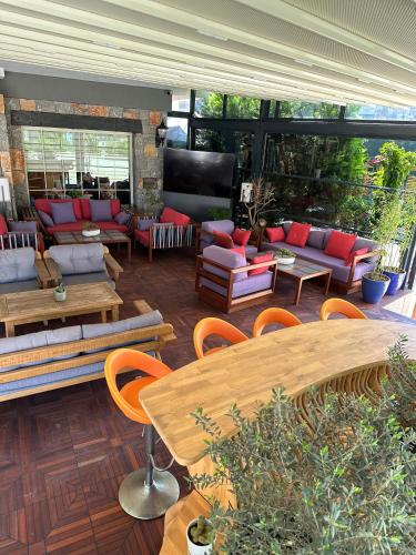 a patio with couches and a table and chairs at Hotel Chateau de Ville in Marmaris