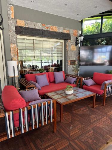 a living room with a couch and a table at Hotel Chateau de Ville in Marmaris
