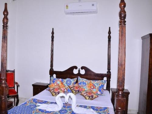 Voodi või voodid majutusasutuse Tej Mahal Palace toas