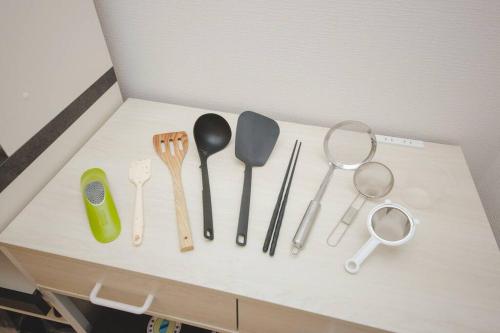 a bunch of kitchen utensils sitting on a counter at Piccola Locanda in Itoman